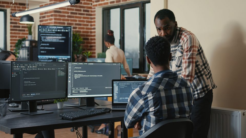 software developer writing code on laptop and comp 2023 11 27 05 29 48 utc